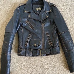 Leather biker jacket by Heroes Motors.